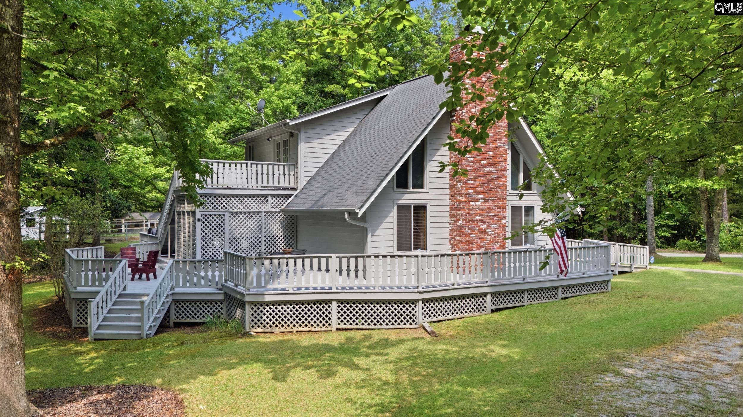 4324 Syrup Mill Road Ridgeway, SC 29130 - Photo 53 of 61 a view of a house with a yard porch and sitting area