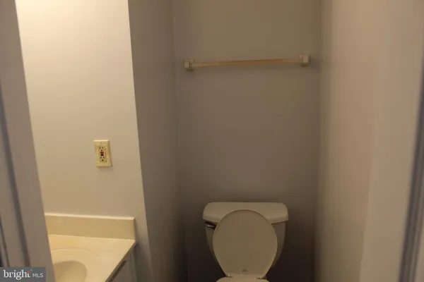 a bathroom with a toilet and a sink