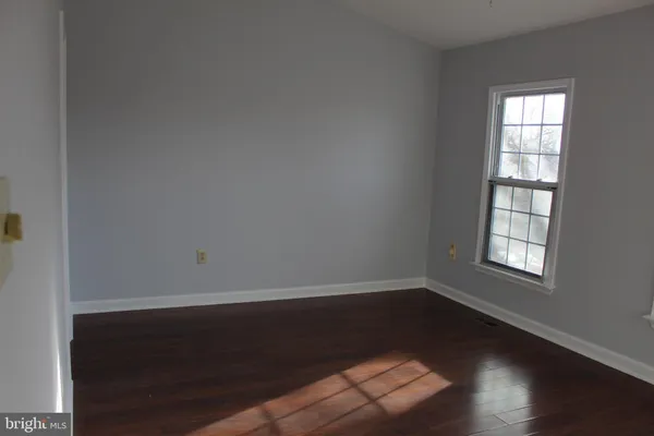 a view of a livingroom with a ceiling fan and window