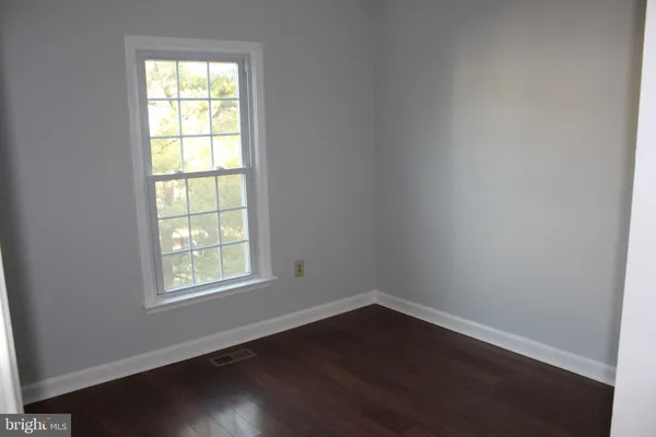 a view of gallery with wooden floor