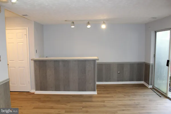 a view of front door with wooden floor