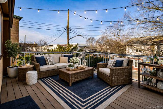 88-02 88th Street Queens, NY 11421 - Photo 15 of 16 a outdoor living room with furniture