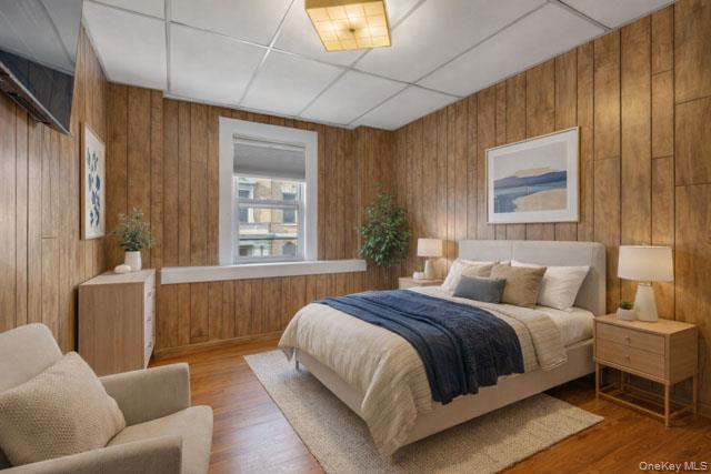 88-02 88th Street Queens, NY 11421 - Photo 7 of 16 a bedroom with a bed and a couch