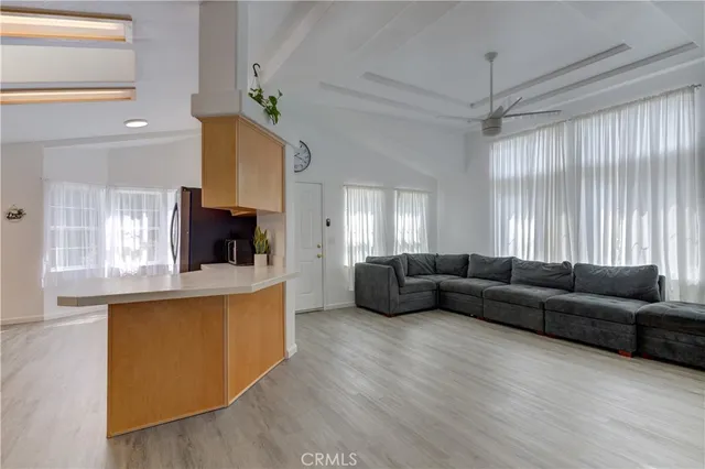 a room with table chairs and window