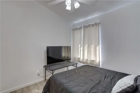 a bedroom with a bed and a chair