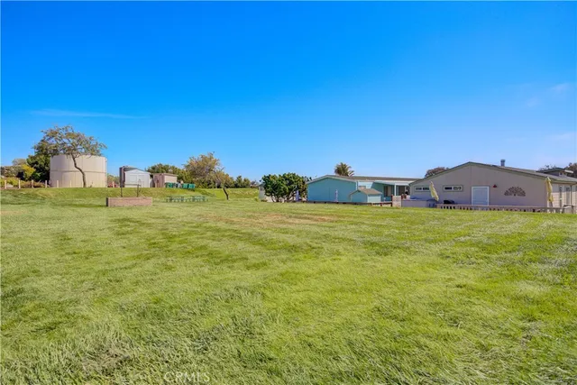 a view of living room with furniture and a large window