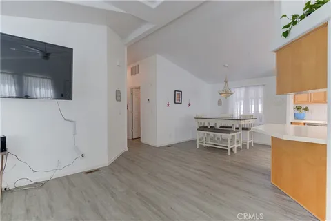 a view of kitchen with sink and refrigerator