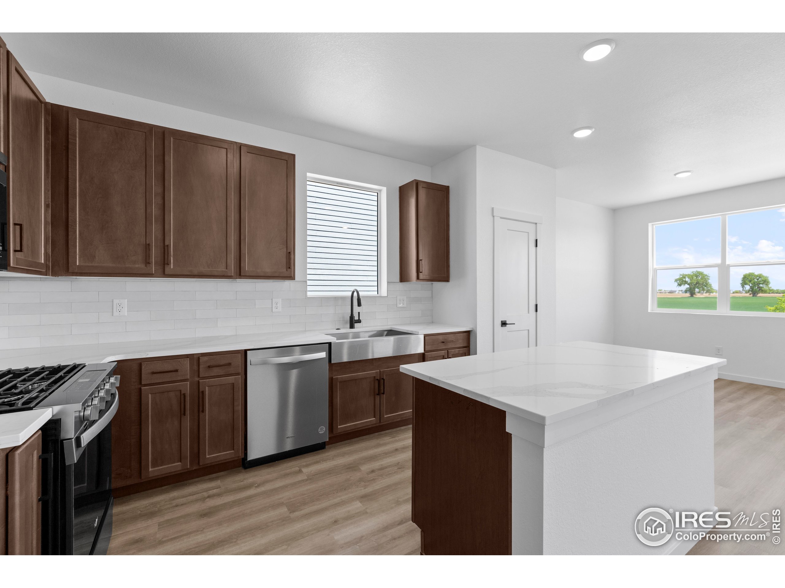 737 Muturu Road Johnstown, CO 80534 - Photo 15 of 26 a kitchen that has a sink and a stove in it