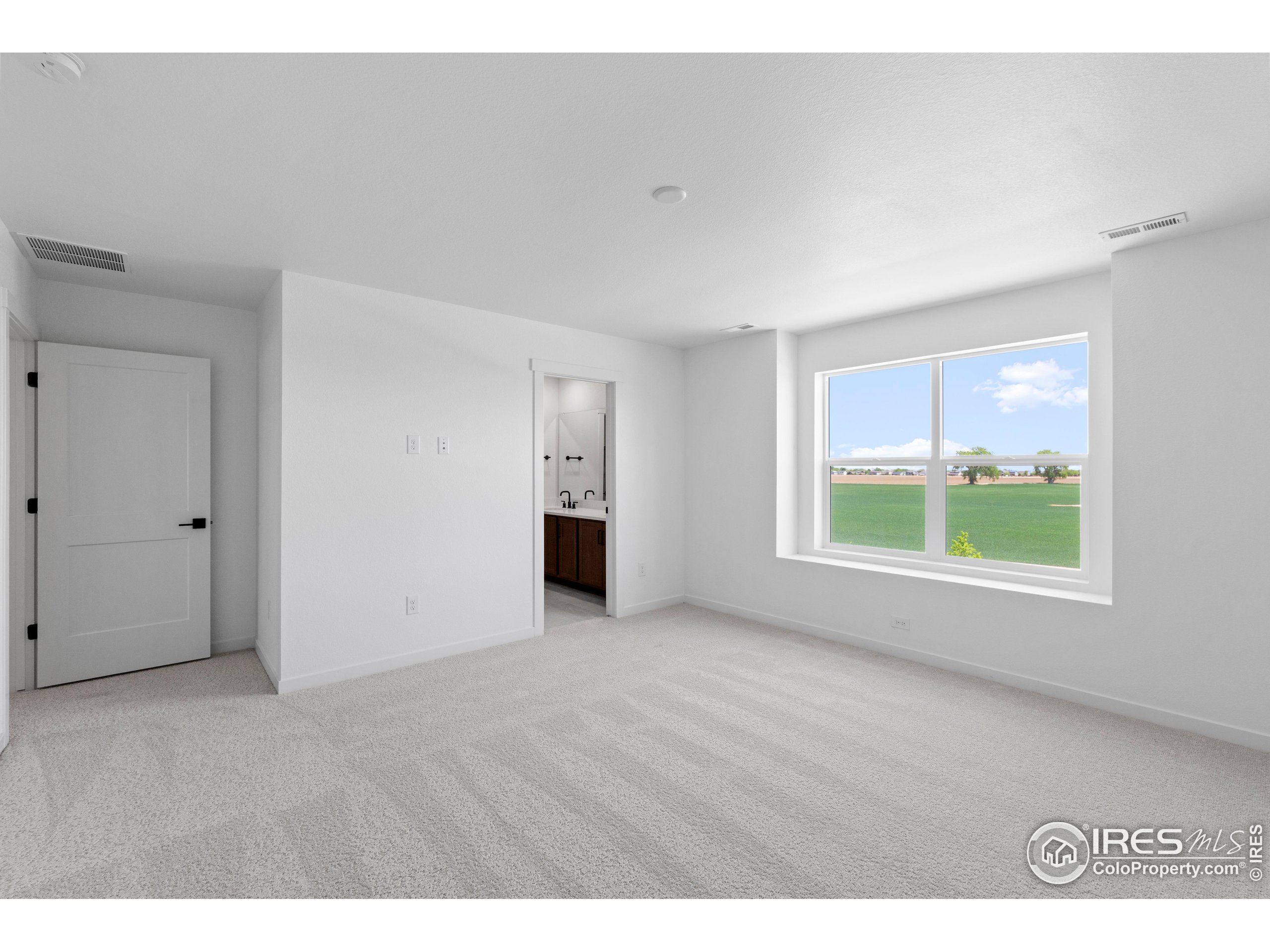 737 Muturu Road Johnstown, CO 80534 - Photo 20 of 26 a view of an empty room with a window