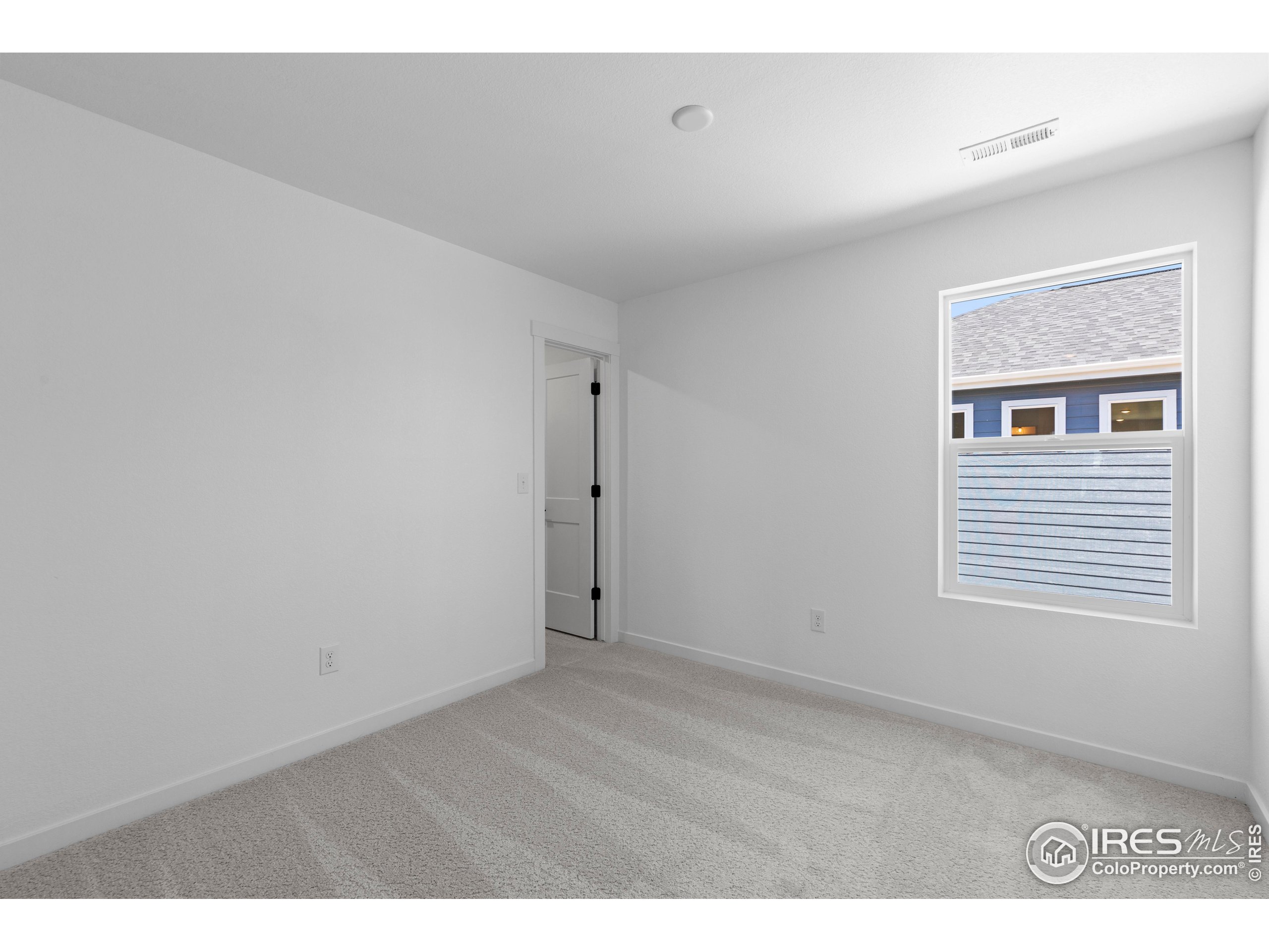 737 Muturu Road Johnstown, CO 80534 - Photo 25 of 26 a view of an empty room with a window