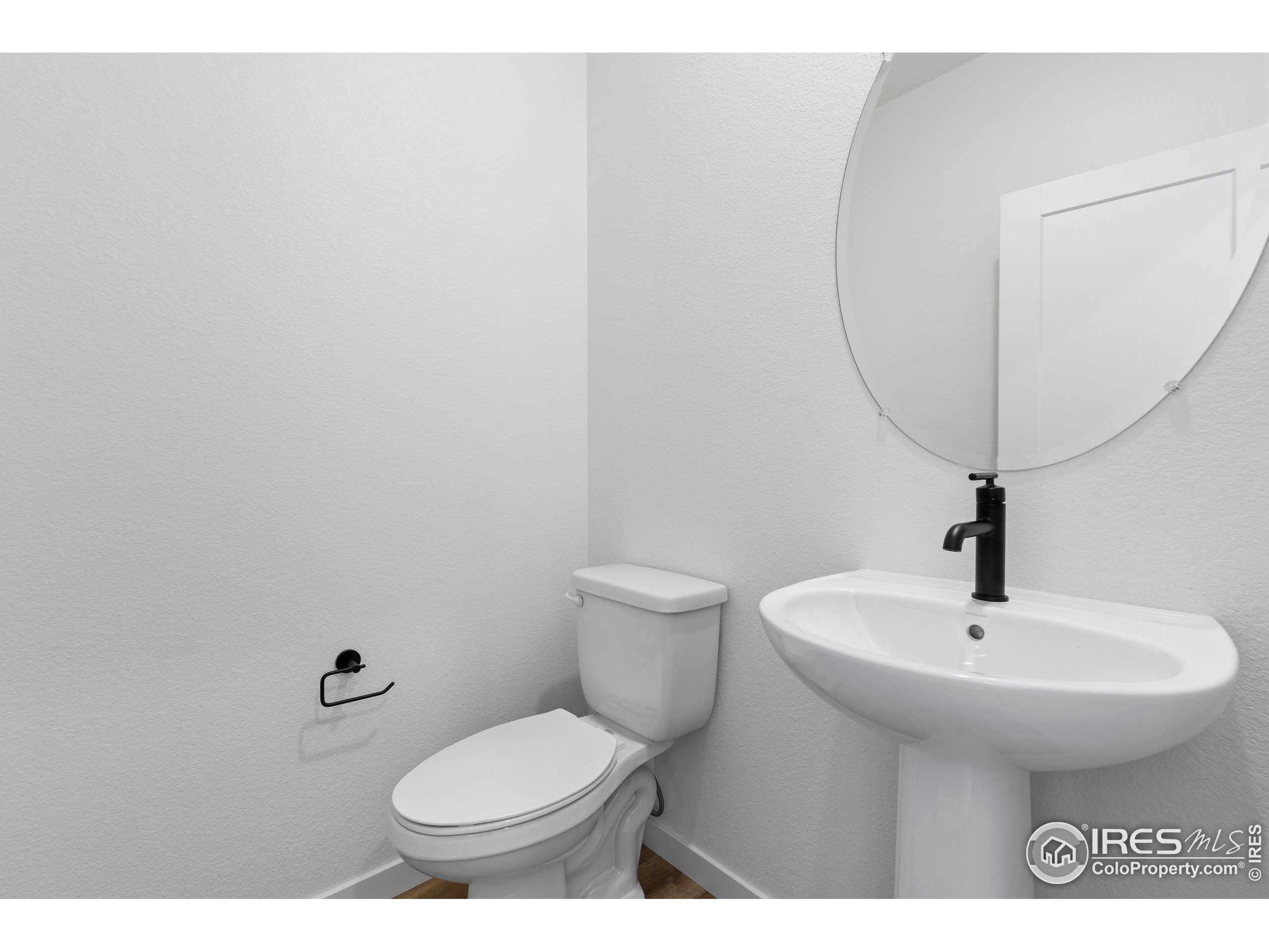737 Muturu Road Johnstown, CO 80534 - Photo 7 of 26 a bathroom with a sink toilet and a mirror