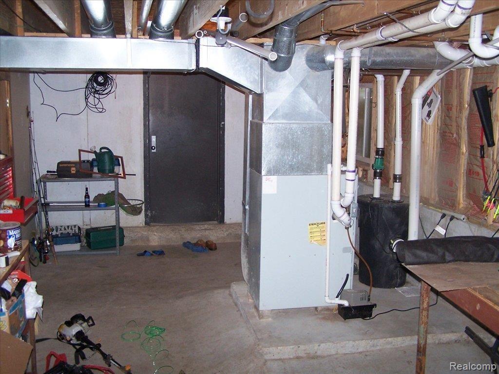 5140 Maybee Road Clarkston, MI 48346 - Photo 5 of 25 Basement storage