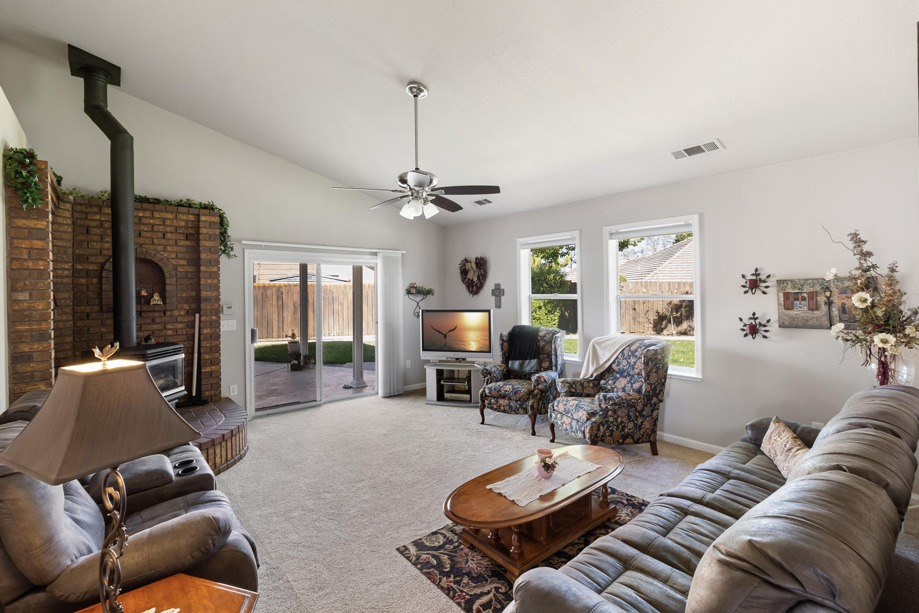 3884 Andes Drive Redding, CA 96001 - Photo 11 of 56 a living room with furniture and a chandelier