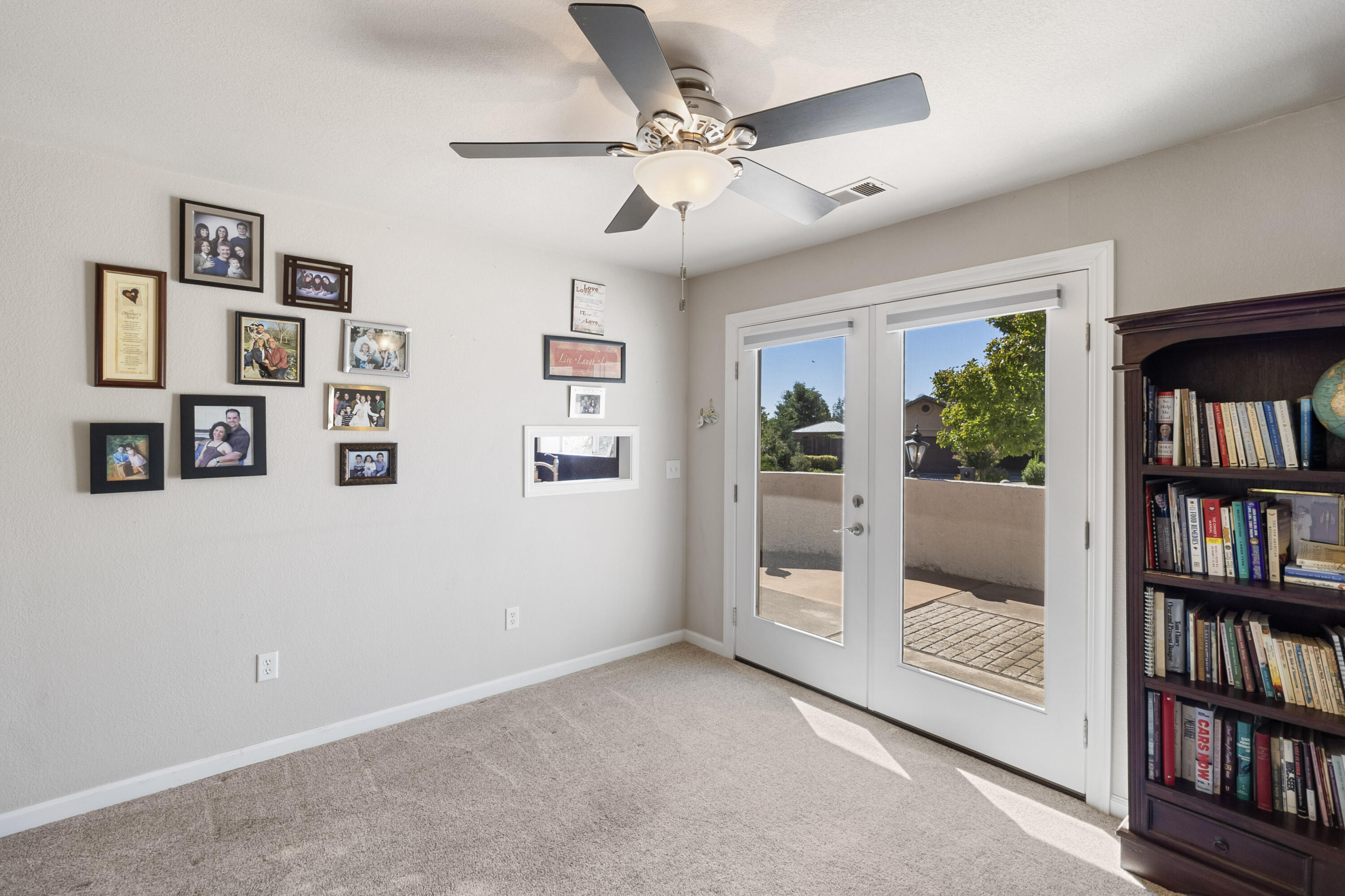 3884 Andes Drive Redding, CA 96001 - Photo 19 of 56 a view of an empty room with shelves and a fan