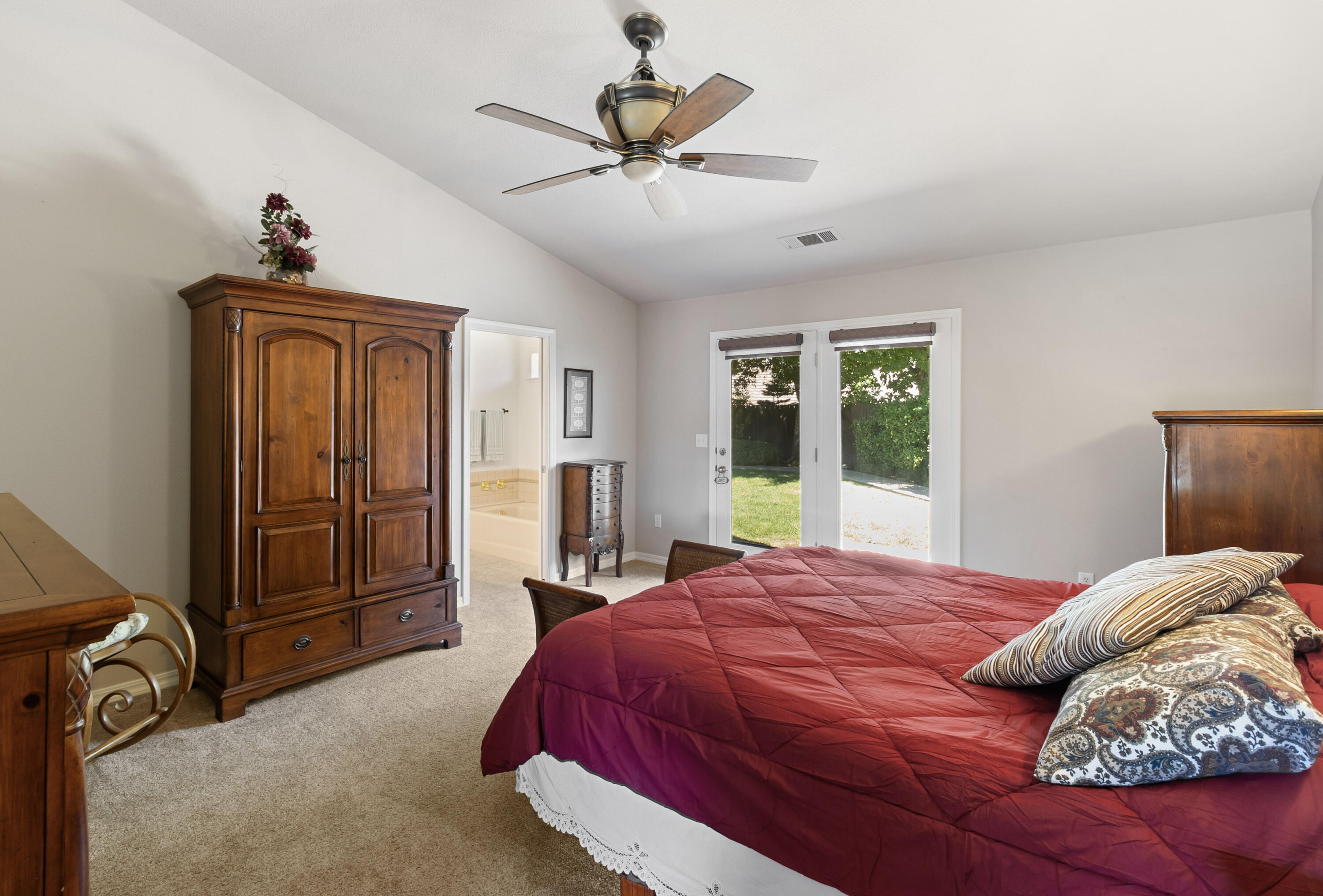 3884 Andes Drive Redding, CA 96001 - Photo 21 of 56 a bedroom with a bed and a ceiling fan