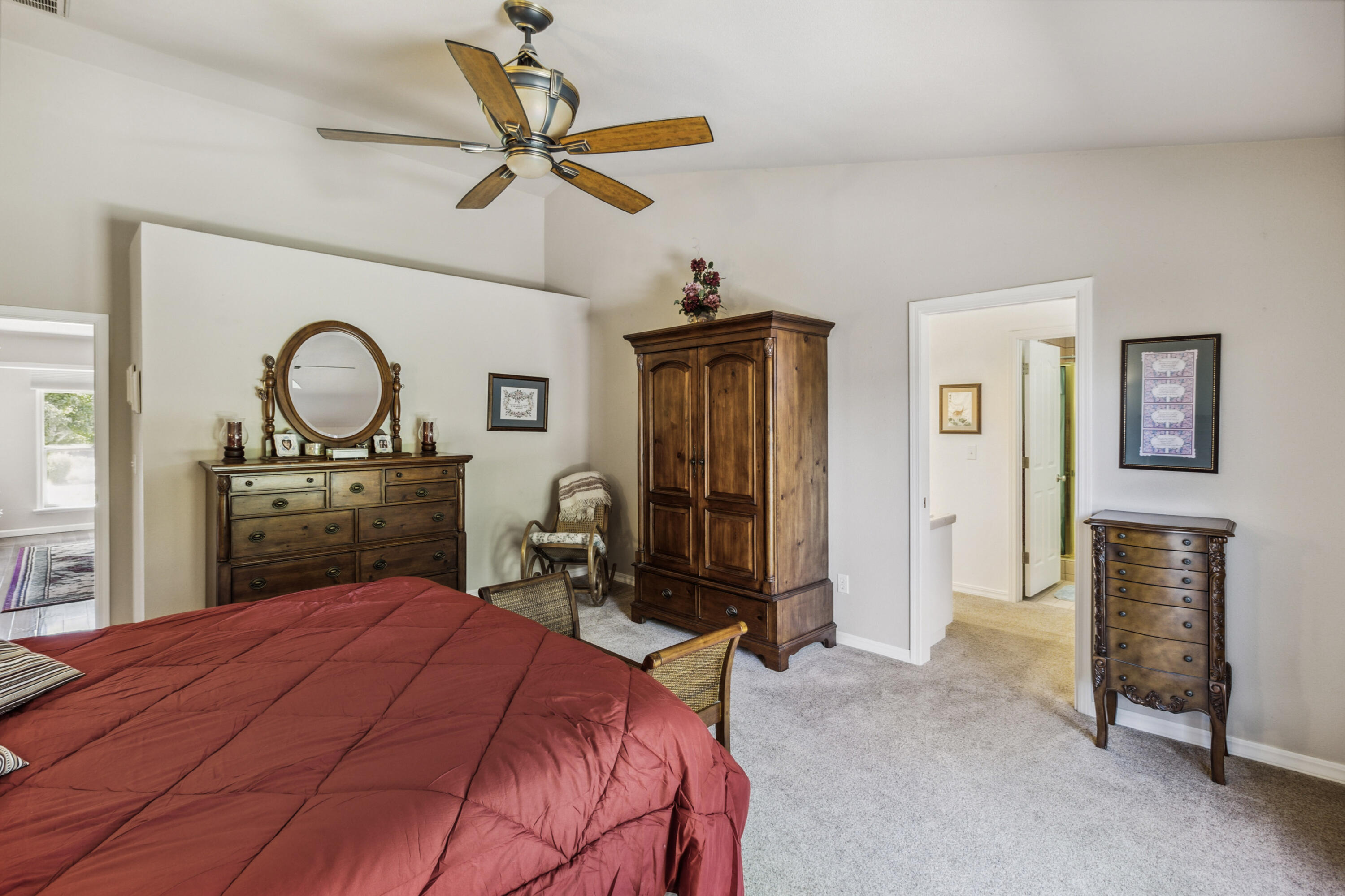 3884 Andes Drive Redding, CA 96001 - Photo 23 of 56 a bedroom with a bed a dresser and chair