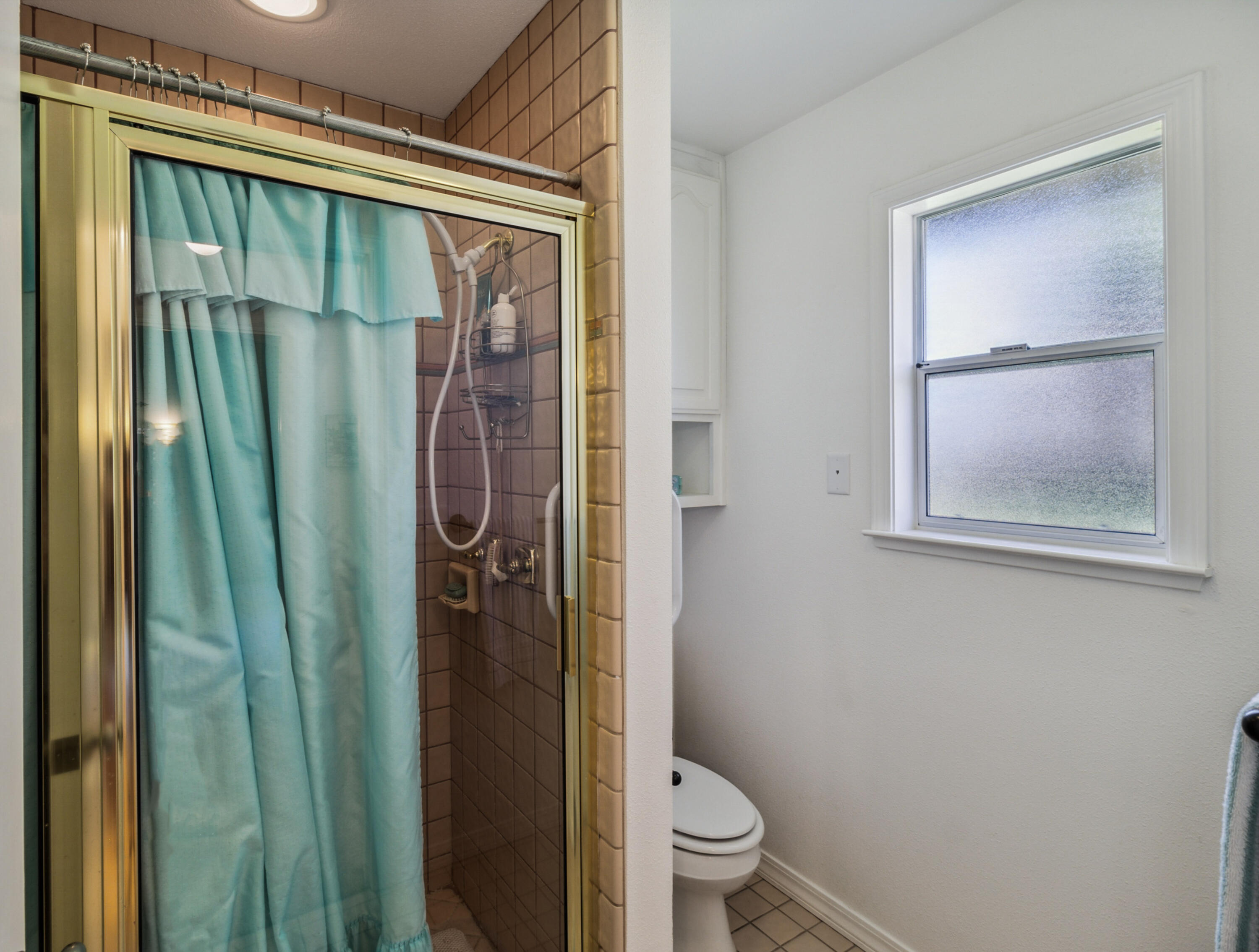 3884 Andes Drive Redding, CA 96001 - Photo 26 of 56 a bathroom with a shower and a toilet