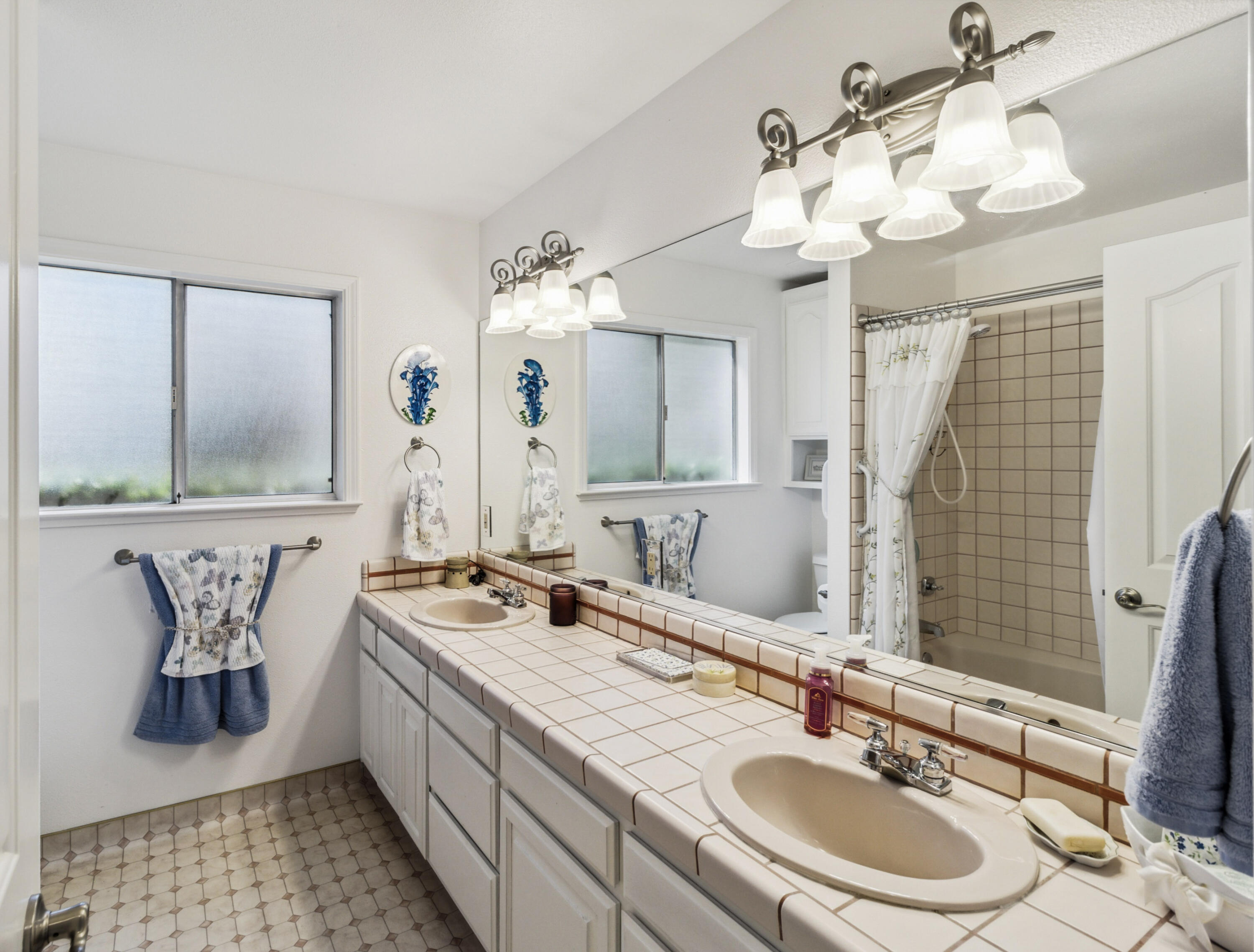 3884 Andes Drive Redding, CA 96001 - Photo 29 of 56 a bathroom with a double vanity sink and a mirror