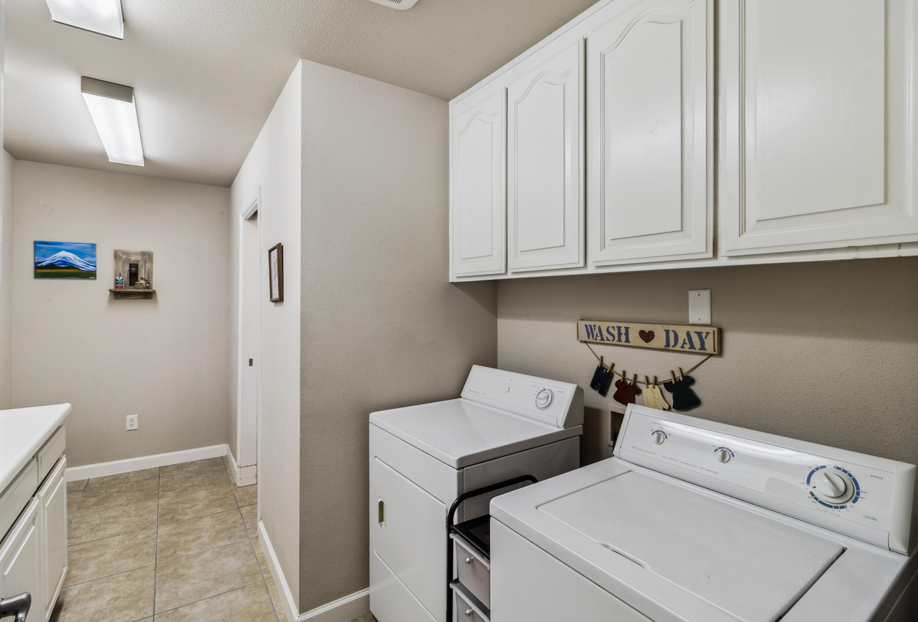 3884 Andes Drive Redding, CA 96001 - Photo 35 of 56 a view of storage and utility room with washer and dryer