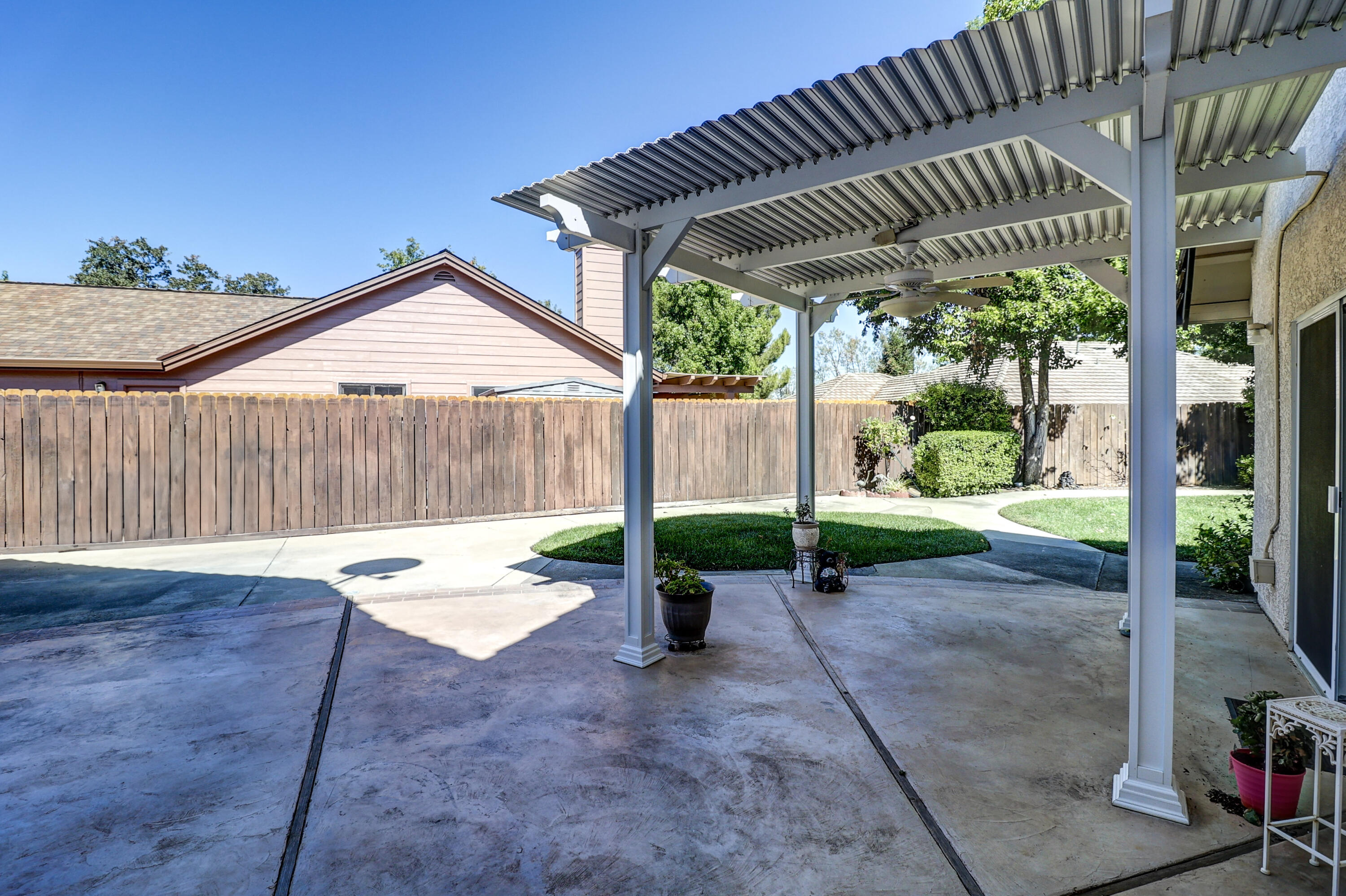 3884 Andes Drive Redding, CA 96001 - Photo 36 of 56 a backyard of a house with table and chairs