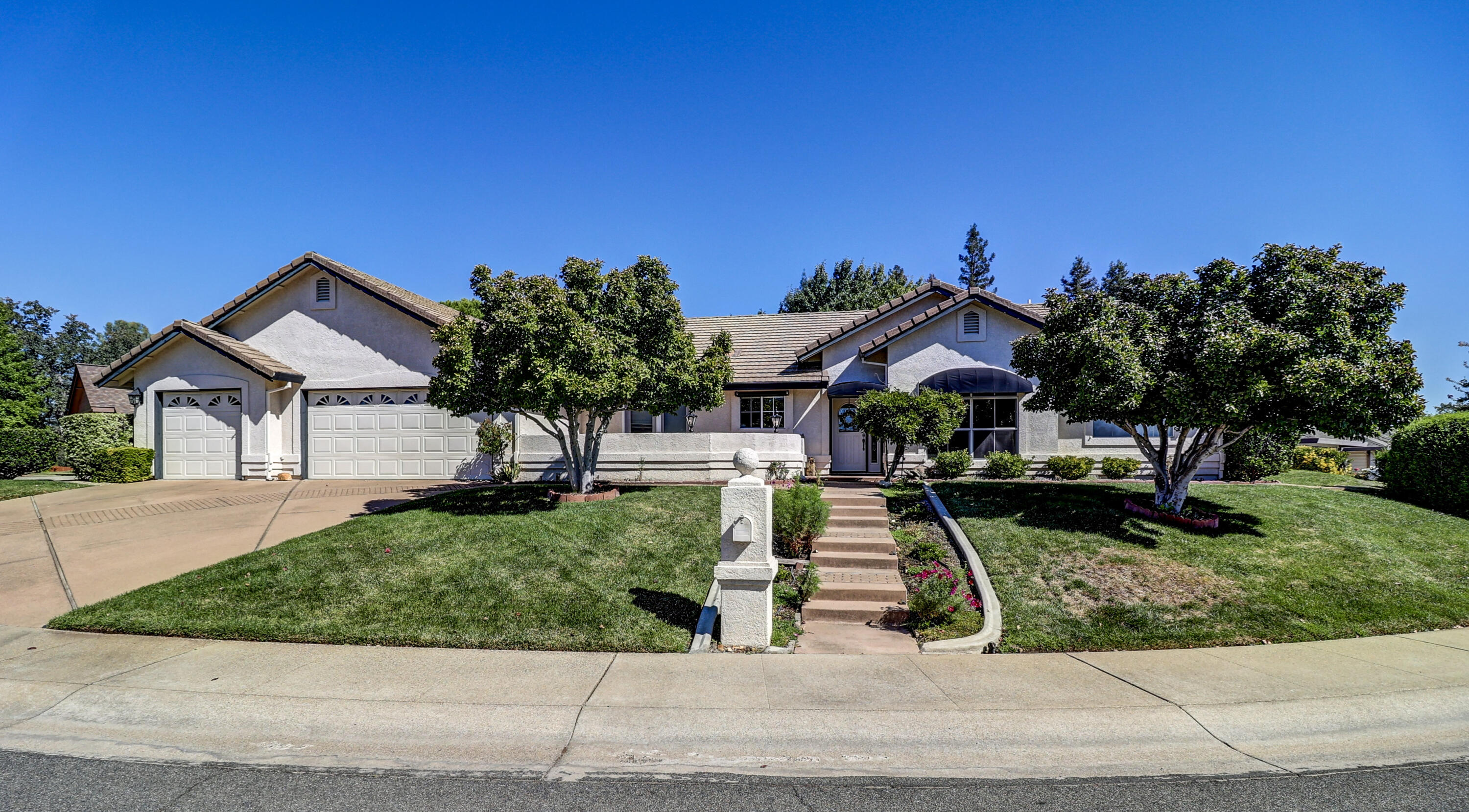 3884 Andes Drive Redding, CA 96001 - Photo 45 of 56 a front view of a house with a yard