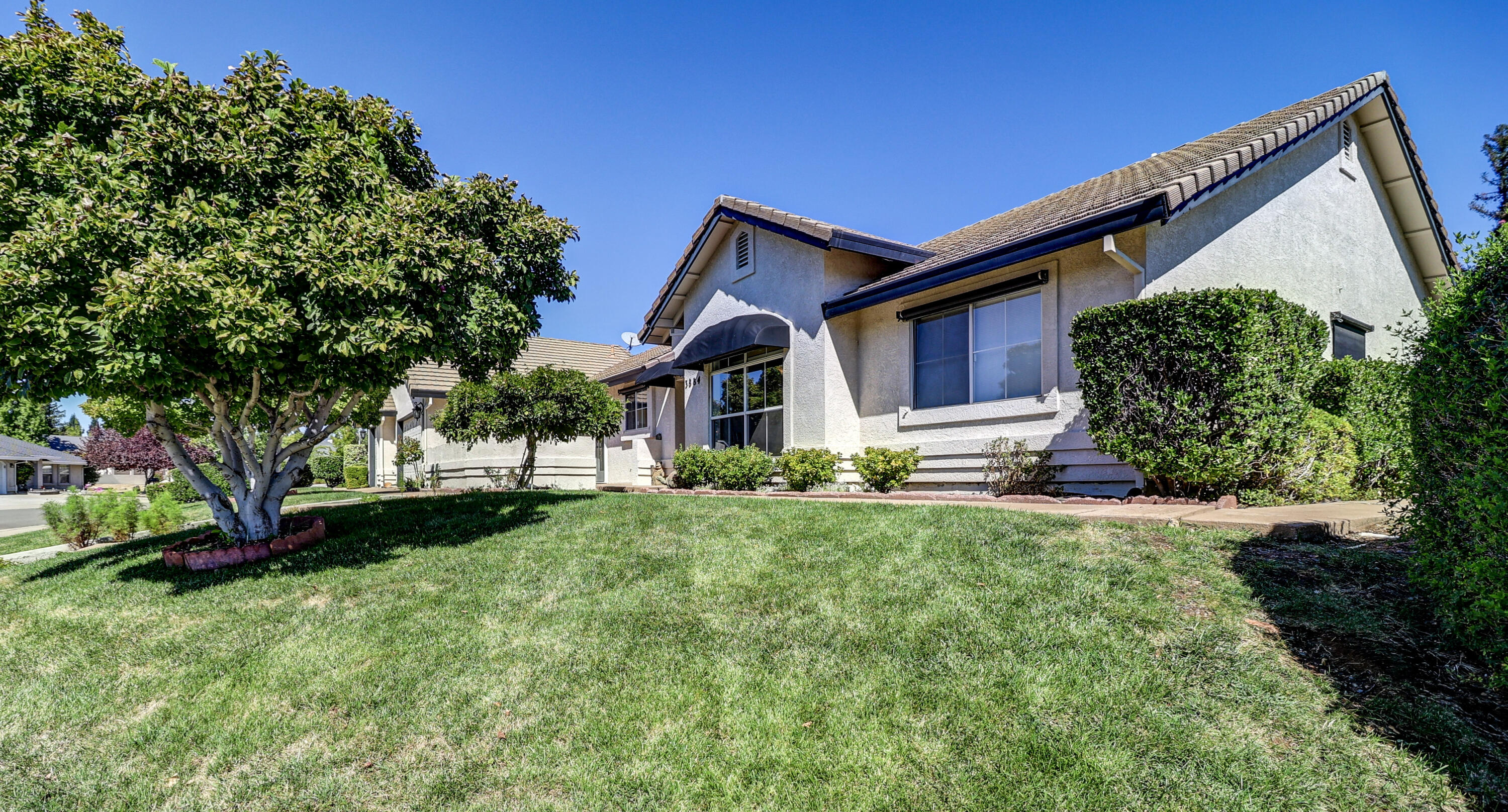 3884 Andes Drive Redding, CA 96001 - Photo 49 of 56 a front view of house with yard and green space