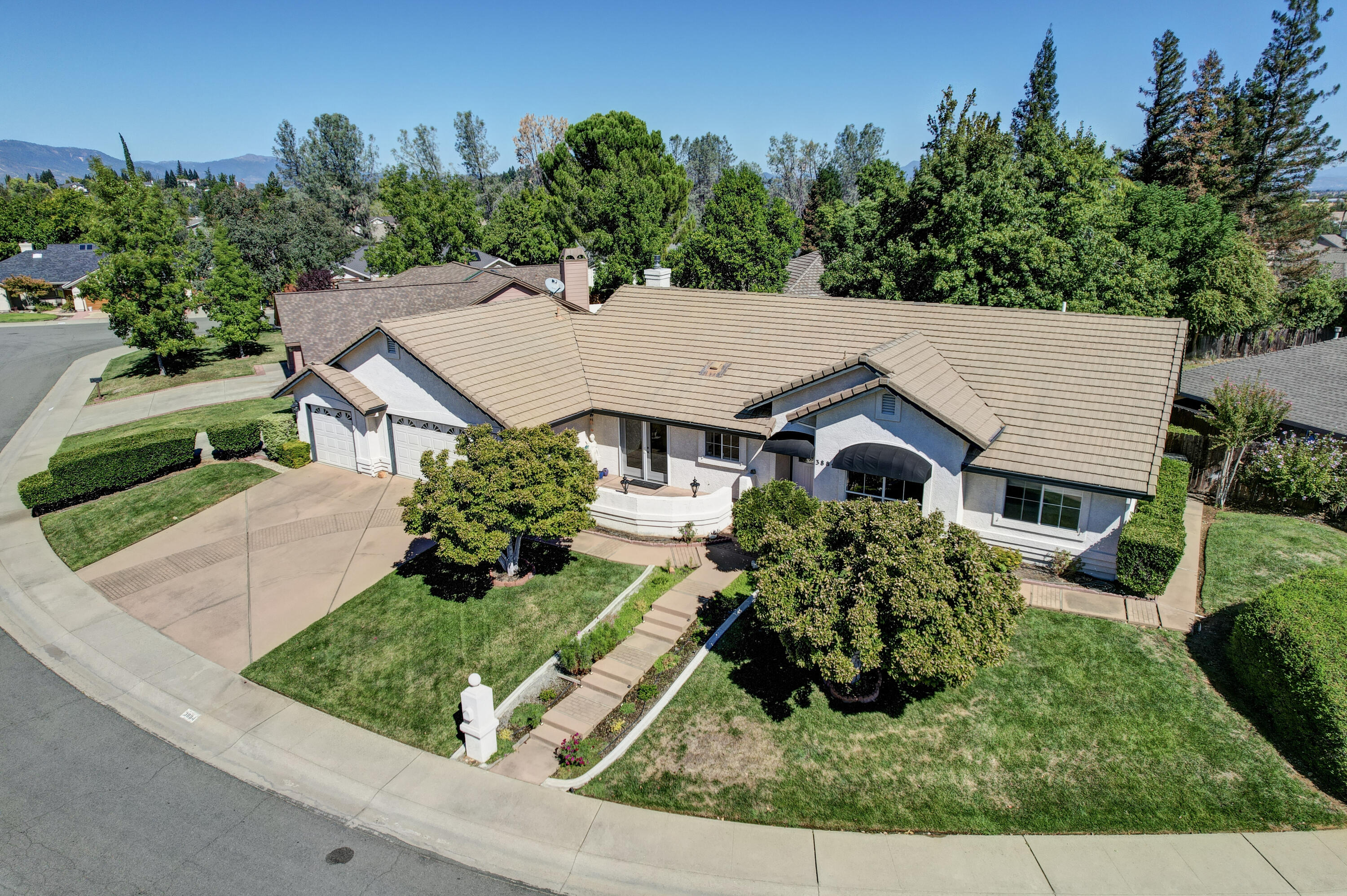 3884 Andes Drive Redding, CA 96001 - Photo 51 of 56 front view of a house with a yard