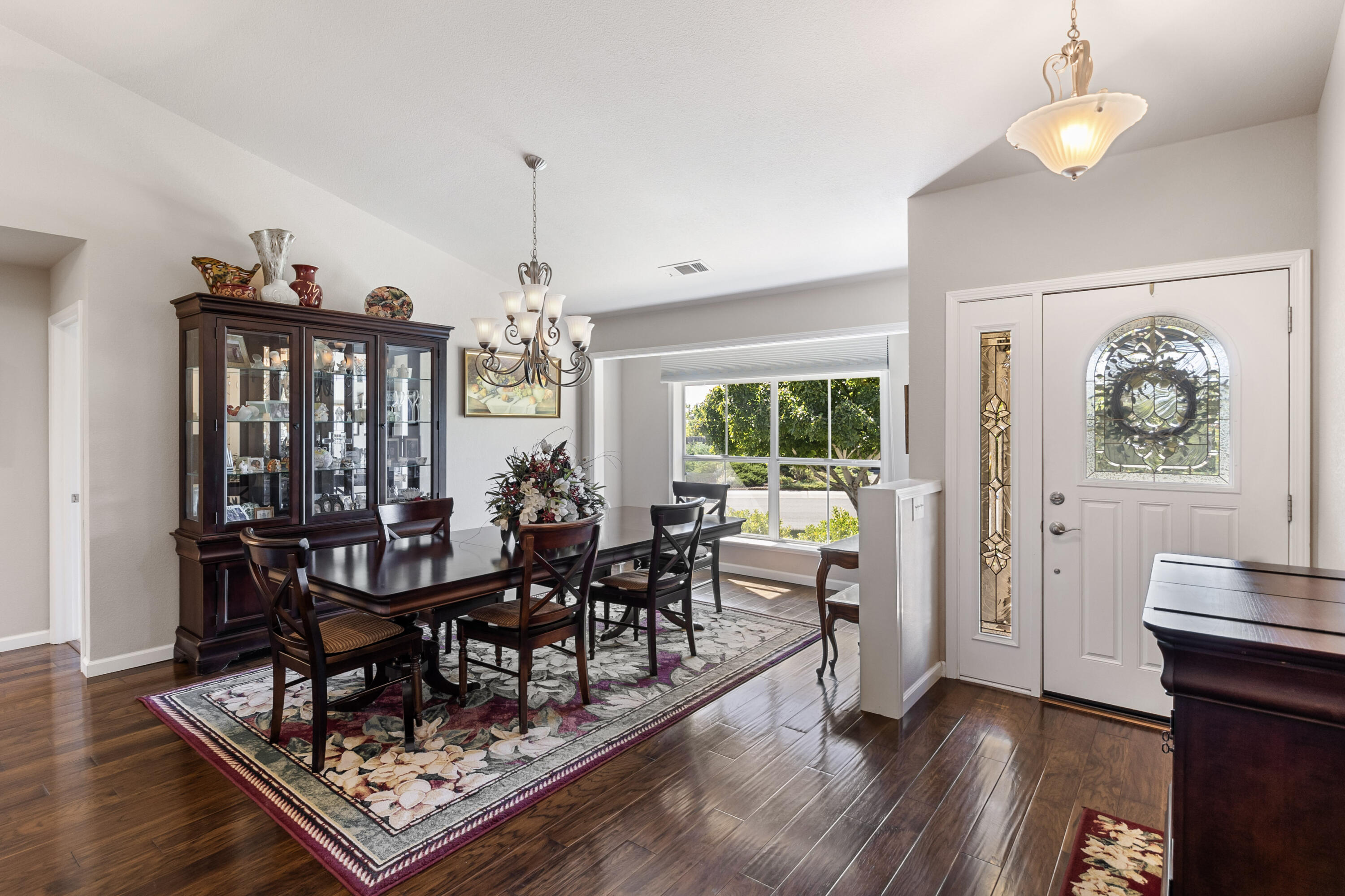 3884 Andes Drive Redding, CA 96001 - Photo 6 of 56 a view of a dining room with furniture window and wooden floor