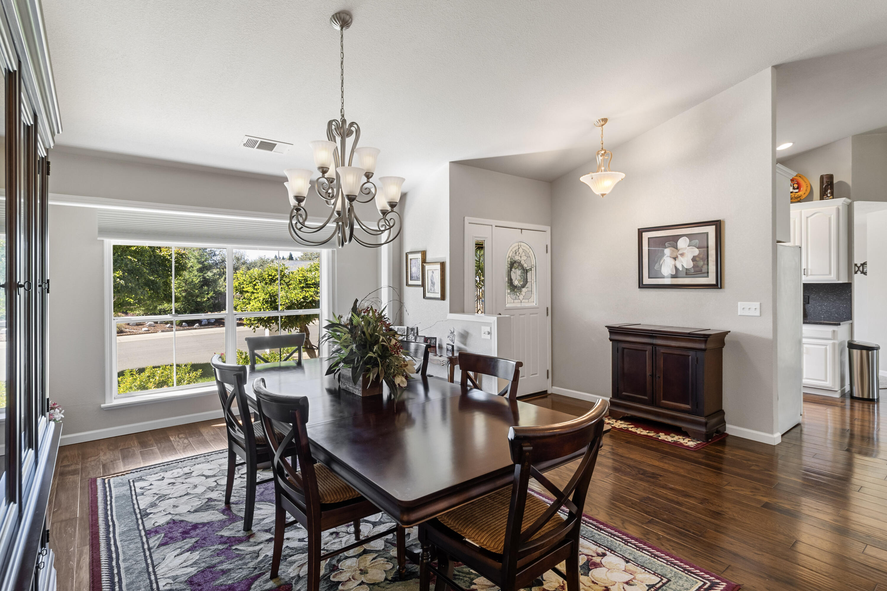 3884 Andes Drive Redding, CA 96001 - Photo 7 of 56 a view of a dining room with furniture window and wooden floor