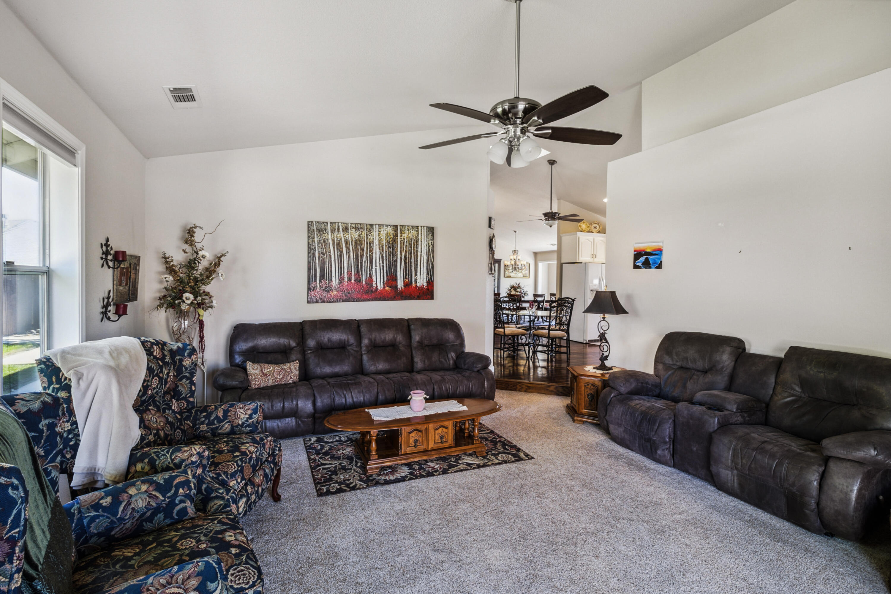 3884 Andes Drive Redding, CA 96001 - Photo 9 of 56 a living room with furniture a rug and a window