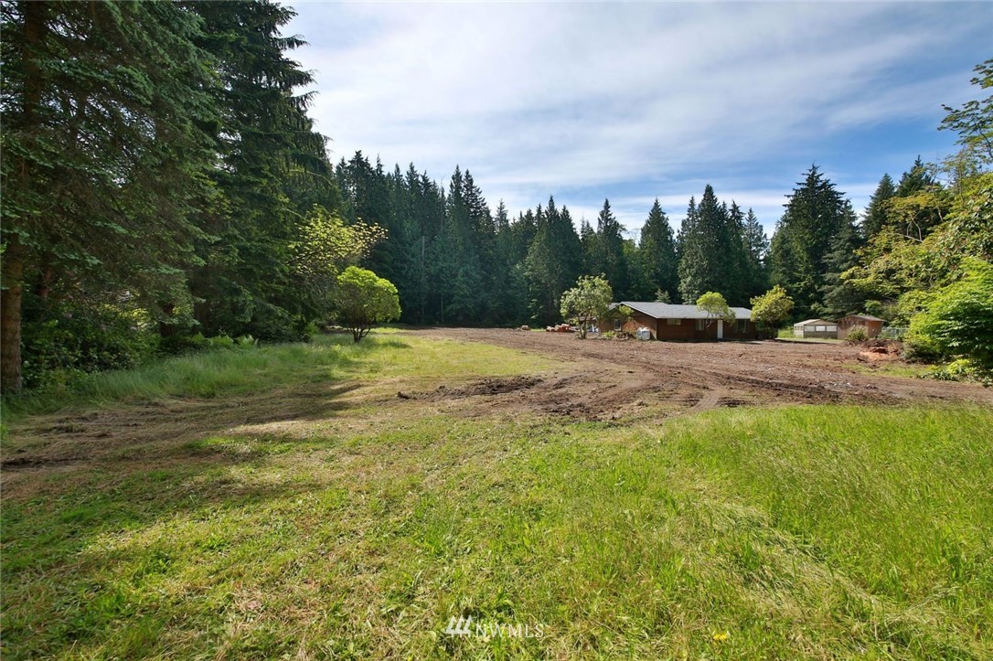 5105 East Harbor Road Freeland, WA 98249 - Photo 8 of 30 a view of outdoor space with green field and trees