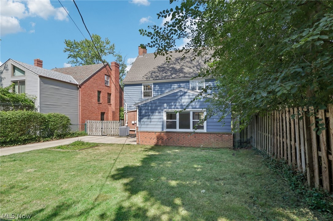 2620 Charney Road Cleveland, OH 44118 - Photo 38 of 43 Back of house with central air condition unit and a yard