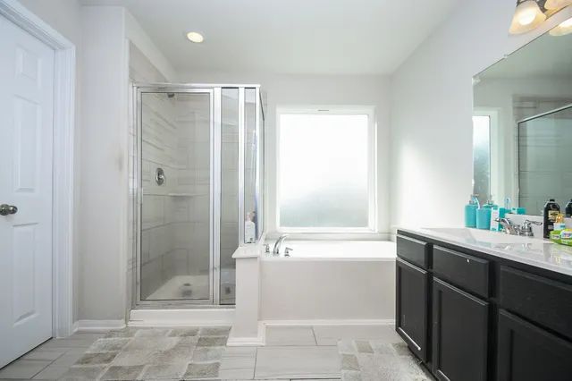 a bathroom with a bathtub shower sink and toilet