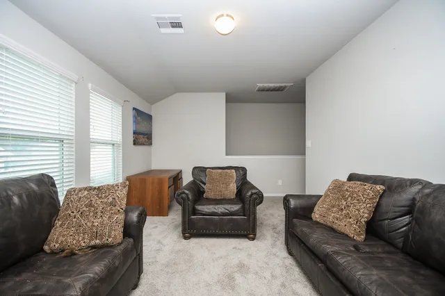 a living room with furniture and a couch