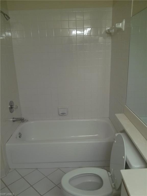 110 Bennington Drive, Unit 8 Naples, FL 34104 - Photo 15 of 18 a bathroom with a toilet and a bathtub