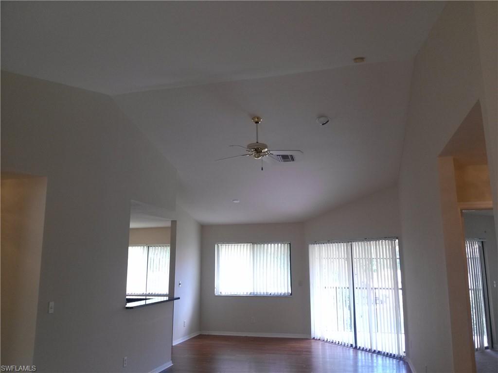 110 Bennington Drive, Unit 8 Naples, FL 34104 - Photo 3 of 18 a view of an empty room with a window