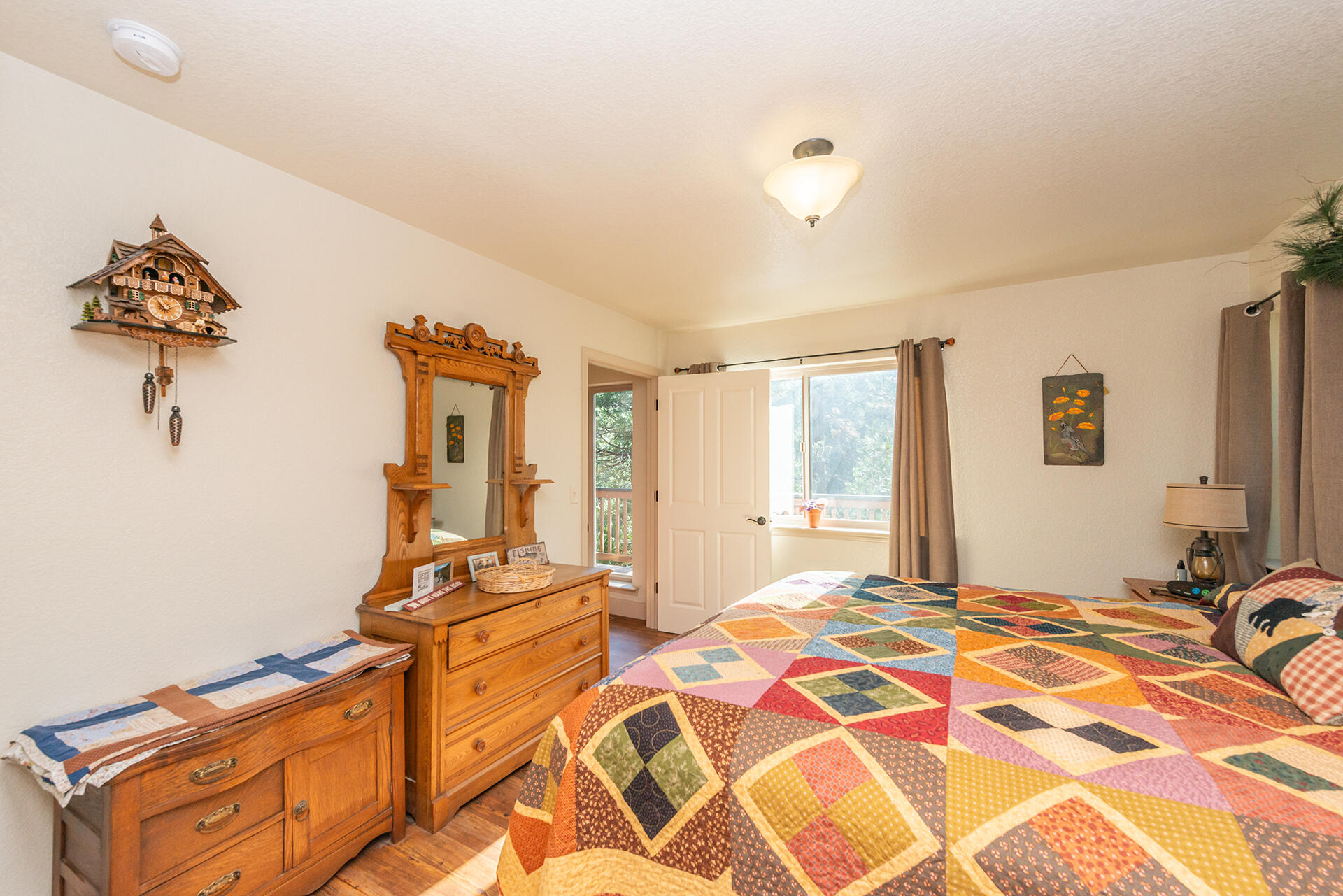 851 Mountain Aire Road Trinity Center, CA 96091 - Photo 18 of 54 a bedroom with double bed and a window