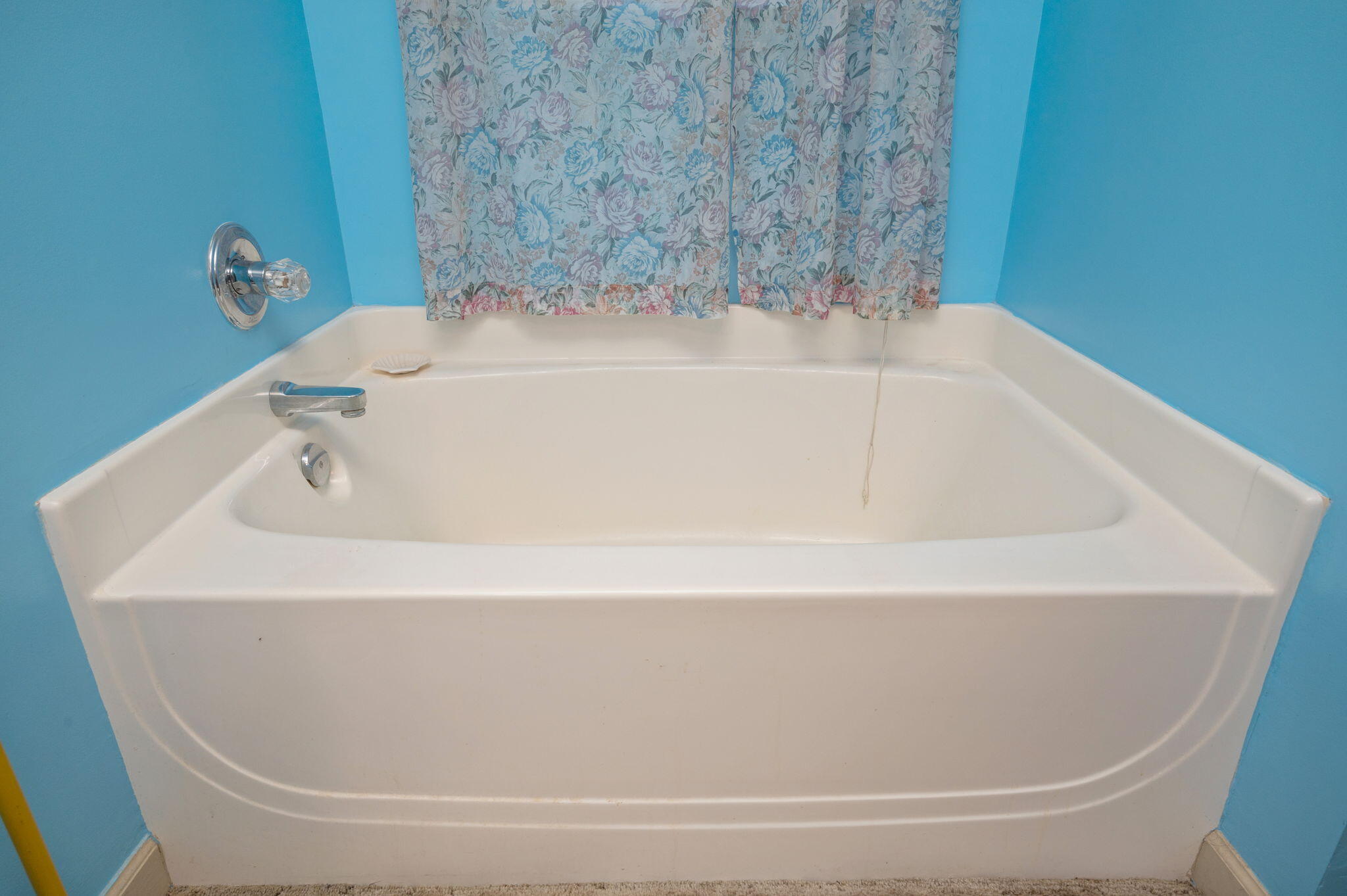 8308 Stokes Road Laurel Hill, FL 32567 - Photo 14 of 27 a white bath tub sitting in a bathroom