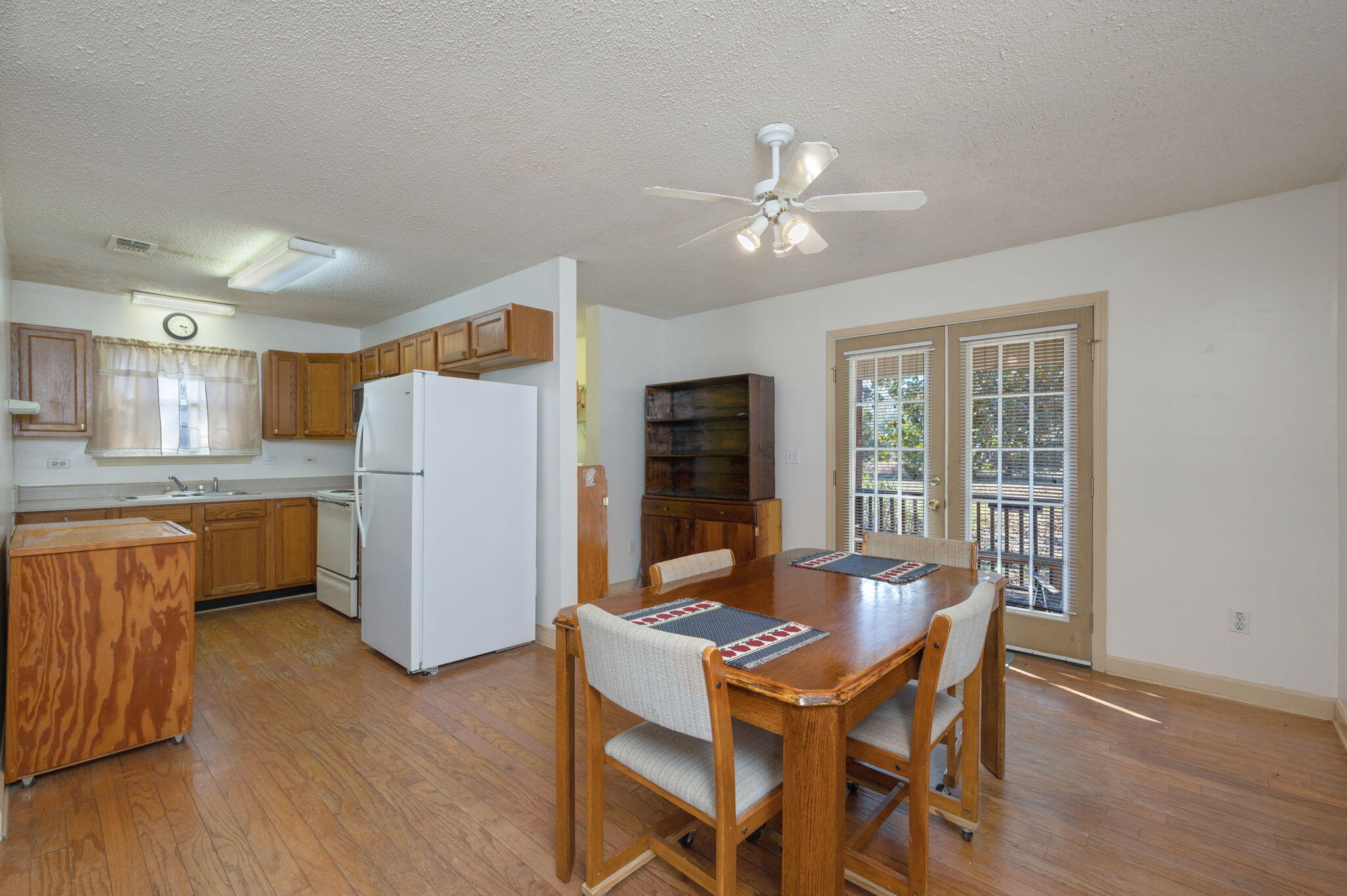 8308 Stokes Road Laurel Hill, FL 32567 - Photo 8 of 27 a view of a dining room with furniture window and wooden floor
