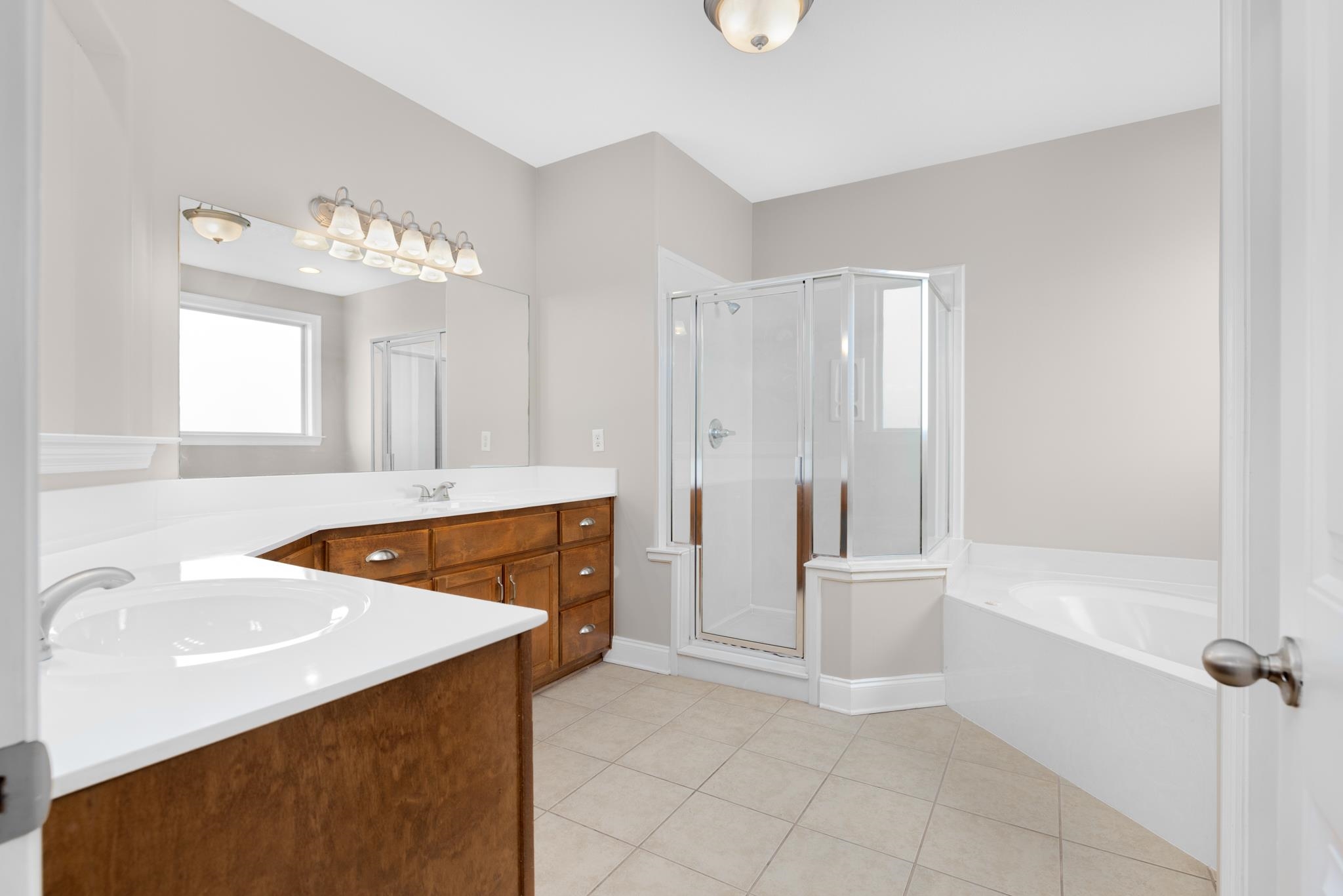 33 Ward Lane Atoka, TN 38004 - Photo 12 of 29 a bathroom with a sink a tub and a mirror