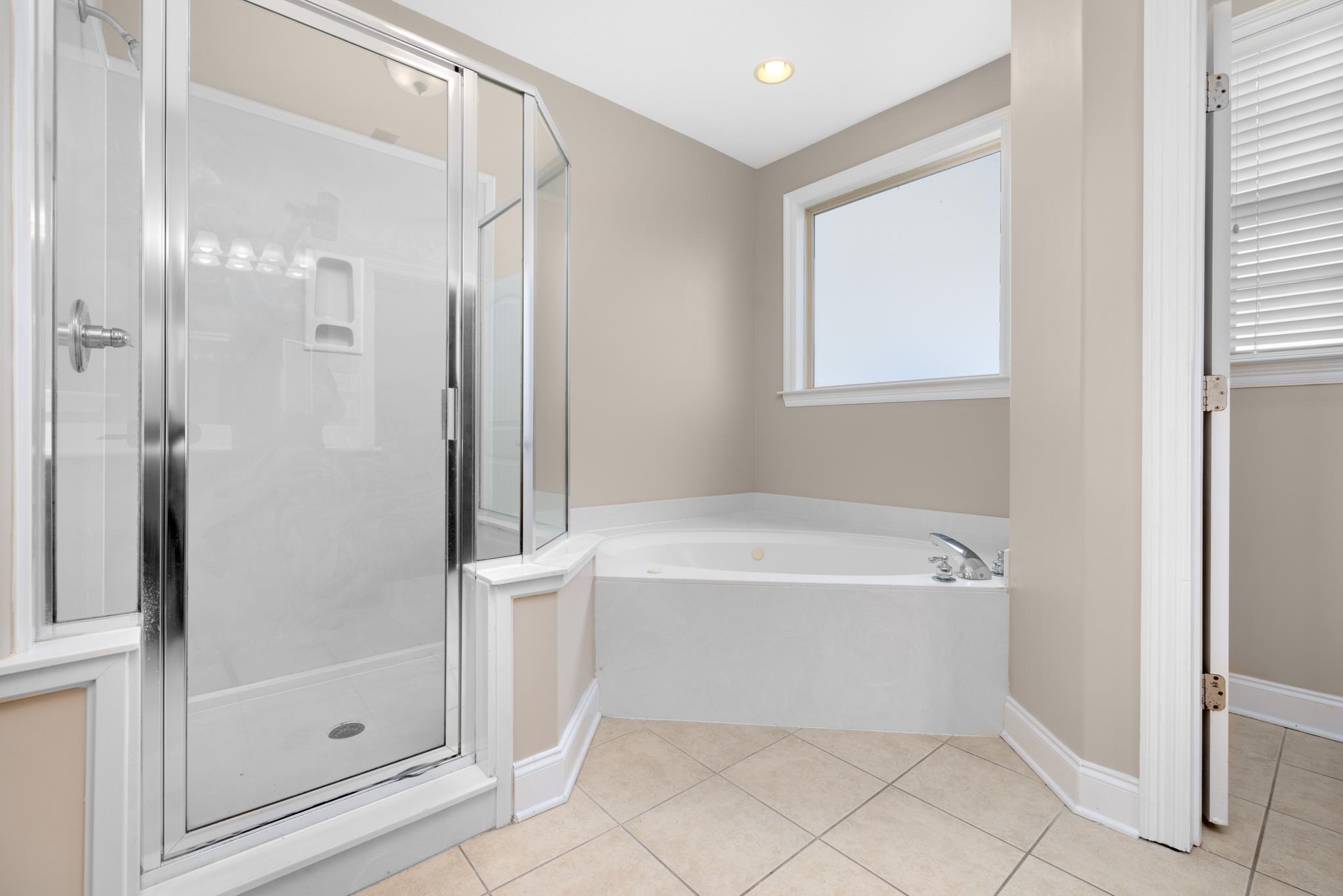 33 Ward Lane Atoka, TN 38004 - Photo 13 of 29 a bathroom with a bathtub and a shower