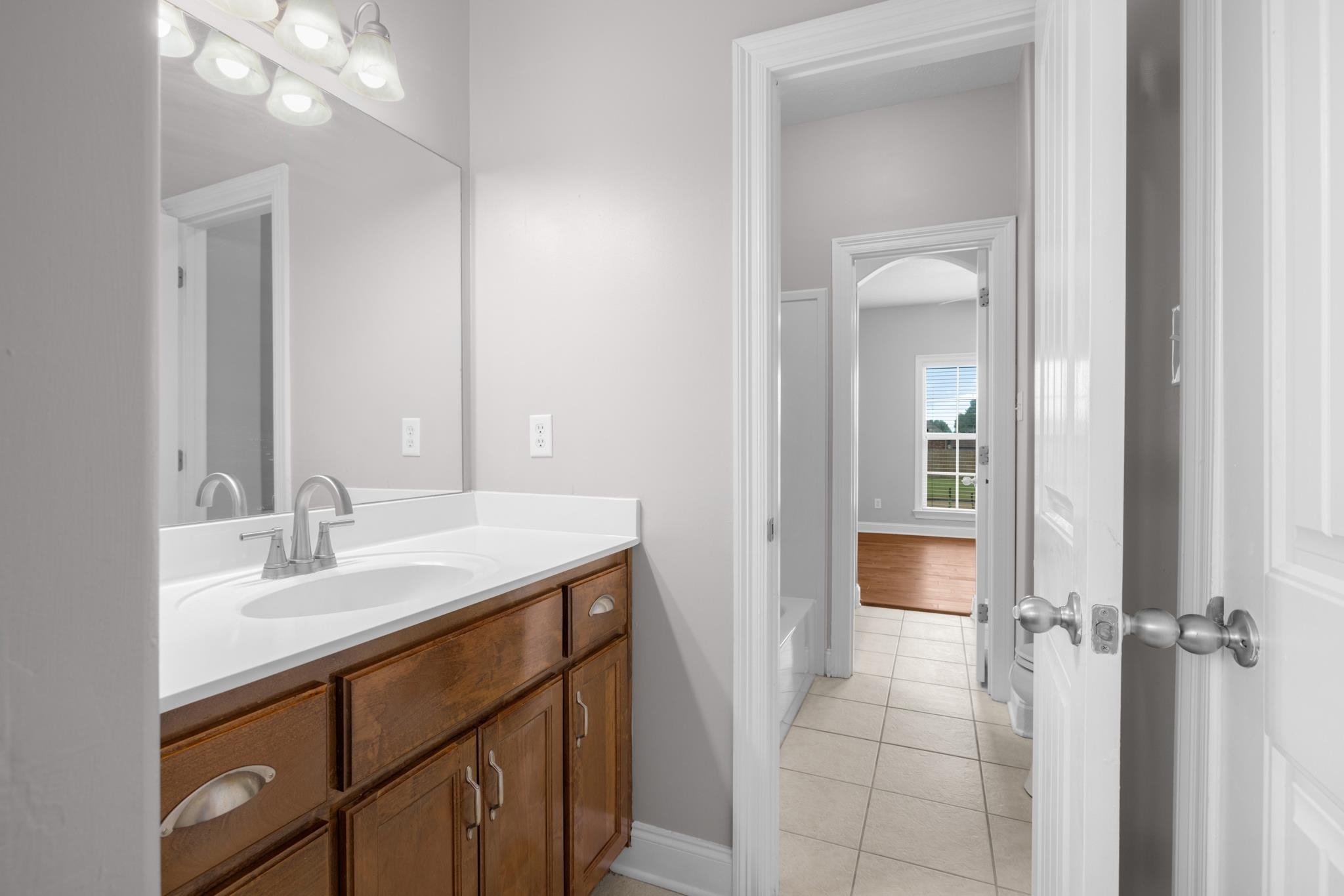 33 Ward Lane Atoka, TN 38004 - Photo 15 of 29 a bathroom with a sink a vanity and a mirror