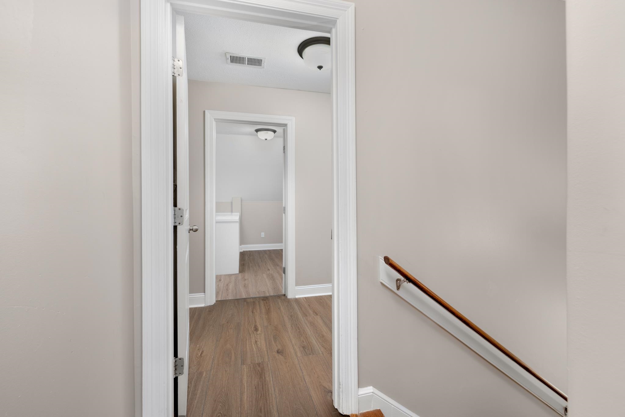 33 Ward Lane Atoka, TN 38004 - Photo 16 of 29 a view of a hallway with wooden floor
