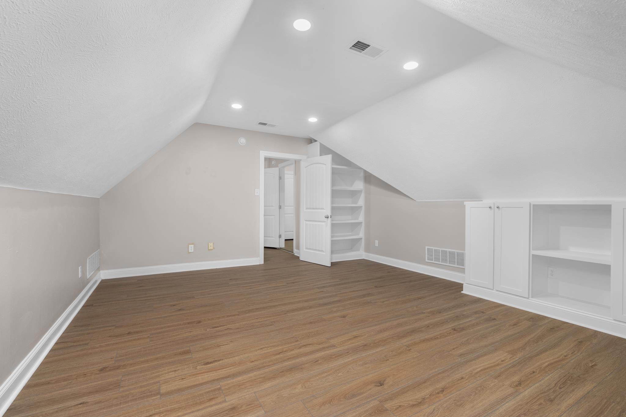 33 Ward Lane Atoka, TN 38004 - Photo 19 of 29 a view of an empty room with wooden floor and entryway