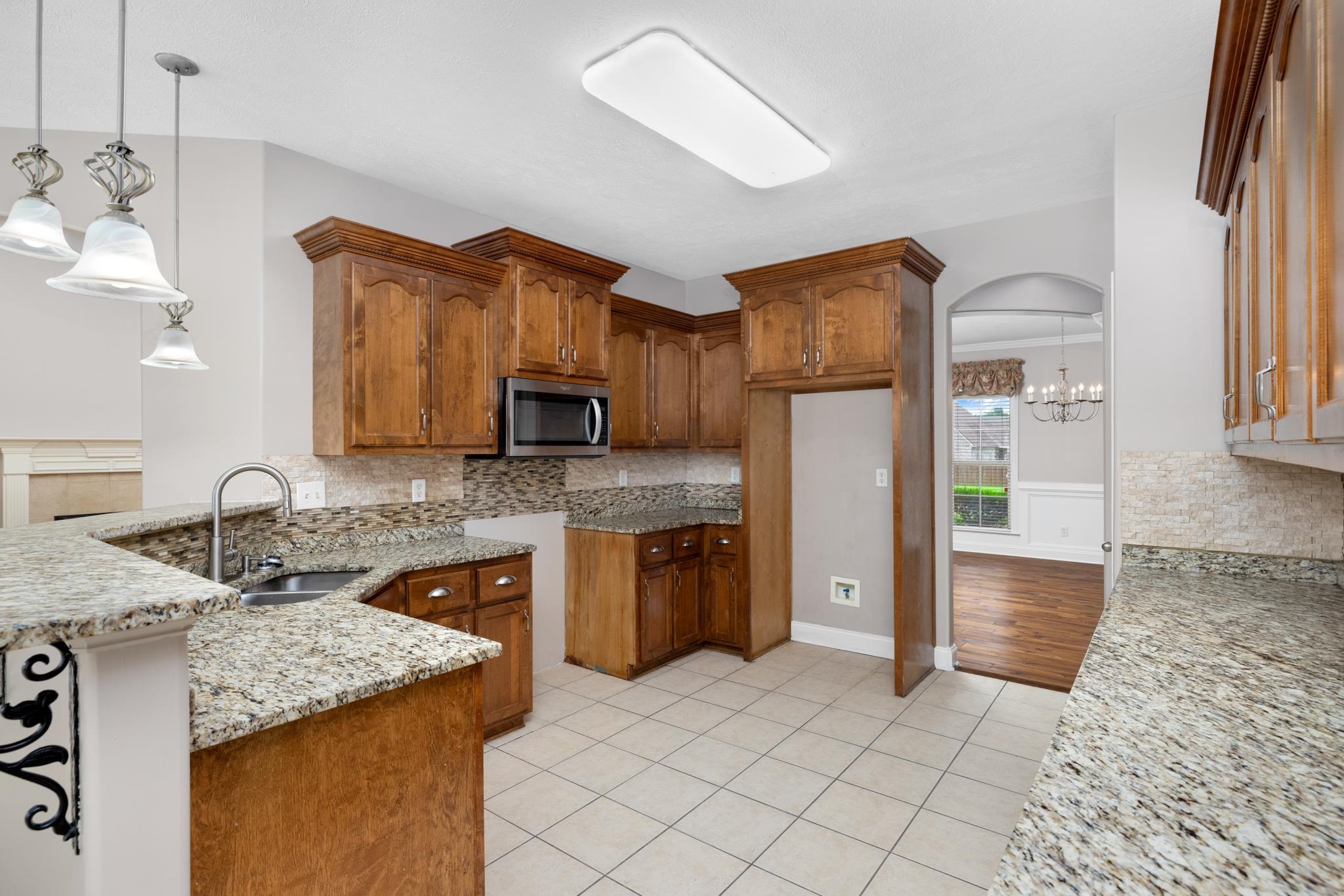 33 Ward Lane Atoka, TN 38004 - Photo 6 of 29 a kitchen with stainless steel appliances granite countertop a refrigerator and a sink