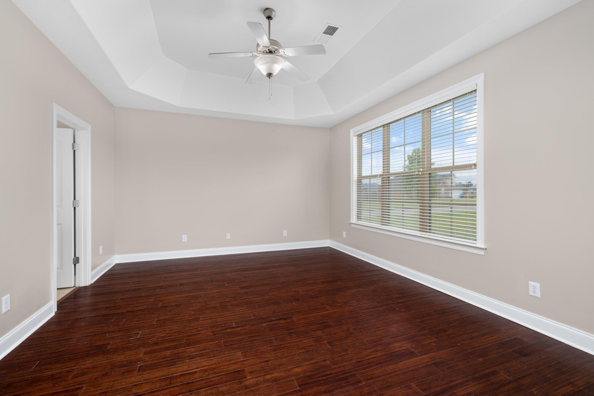 33 Ward Lane Atoka, TN 38004 - Photo 9 of 29 a view of an empty room with wooden floor and a window