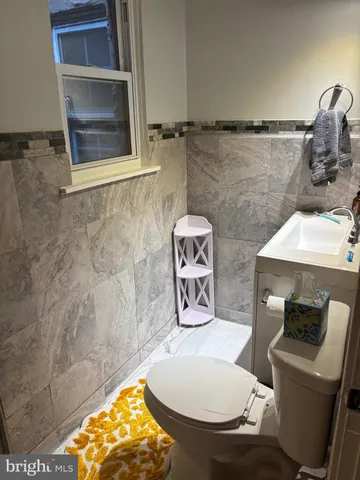 a bathroom with a toilet and a sink