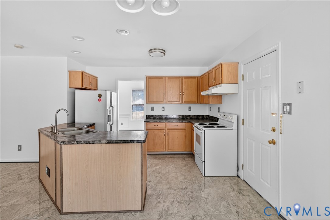 6125 Waterman Place Chesterfield, VA 23832 - Photo 10 of 45 a kitchen with a sink a stove a refrigerator and cabinets