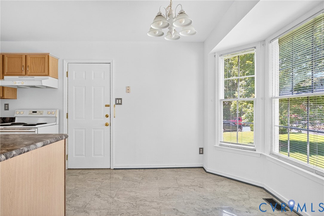 6125 Waterman Place Chesterfield, VA 23832 - Photo 15 of 45 Kitchen featuring a chandelier, white electric ran