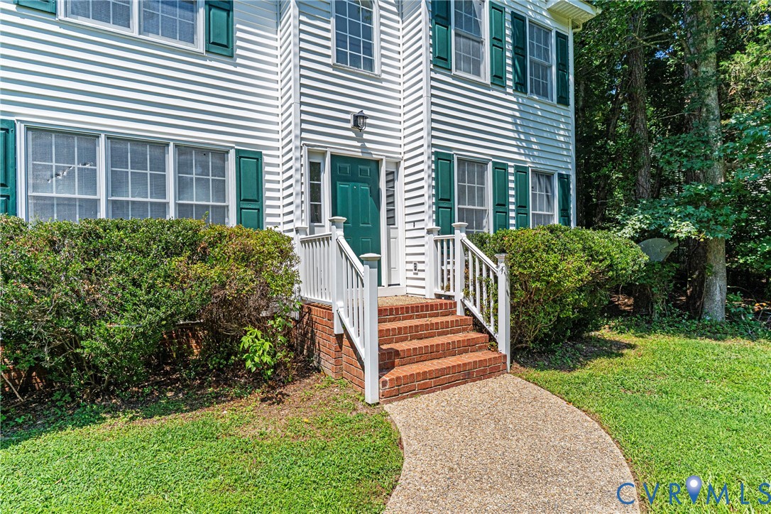 6125 Waterman Place Chesterfield, VA 23832 - Photo 2 of 45 a view of a house with backyard and a garden